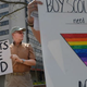 Oliver Tessier holds a sign as he protests for equality within the Boy Scouts of America. (Matt McClain/the Washington Post)